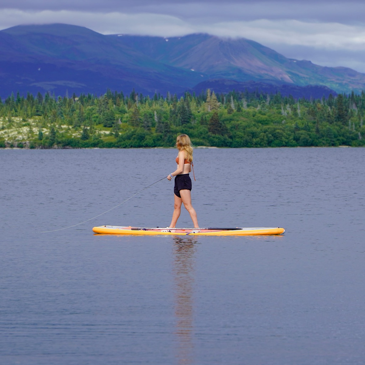Ella fly fishing in Lake Iliamna